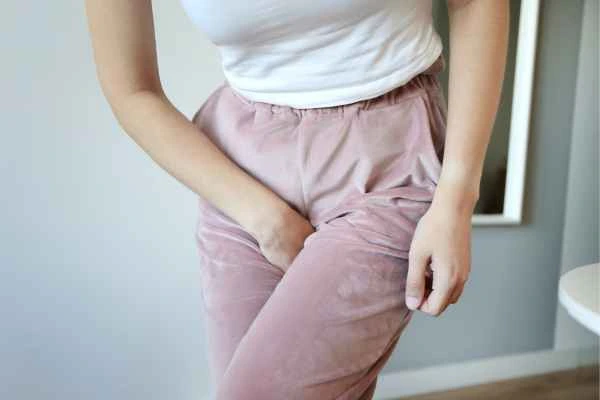 older woman running to the toilet because of urinary incontinence Redhill